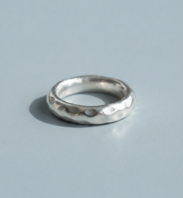 Fine silver band with a hammered texture