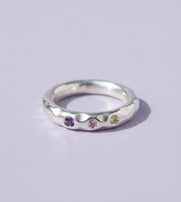 Fine silver ring set with small purple and yellow stones